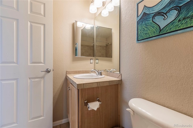 9760 Mayfair St Unit A, Englewood, CO 80112 - bathroom featuring vanity and a textured wall
