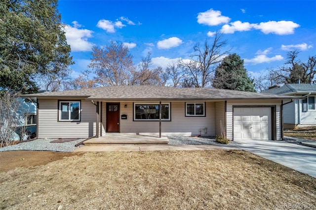 single story home with a garage, covered porch, driveway, and a shingled roof