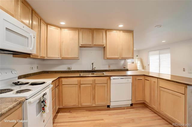 kitchen featuring light hardwood / wood-style floors, sink, light brown cabinetry, and white appliances