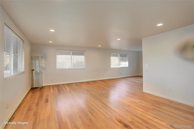 unfurnished room featuring light hardwood / wood-style floors