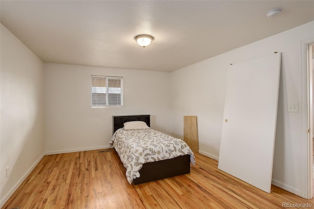 bedroom with light hardwood / wood-style flooring