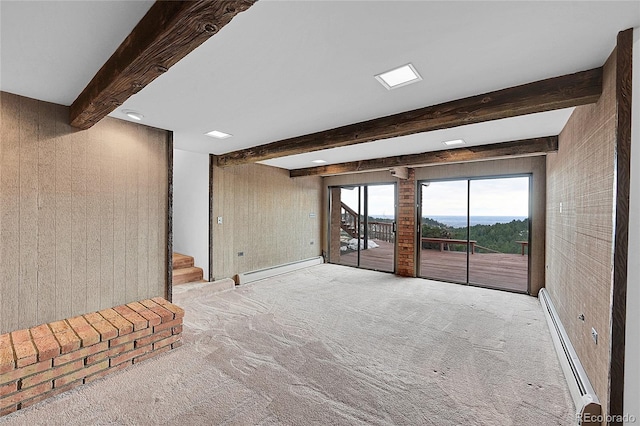 unfurnished living room with a baseboard radiator, beamed ceiling, carpet, and stairs