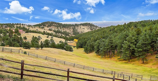 mountain view featuring a rural view