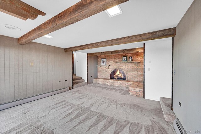 21849 Cabrini Blvd, Golden, CO 80401 - carpeted empty room featuring a baseboard heating unit, a fireplace, stairs, and beamed ceiling