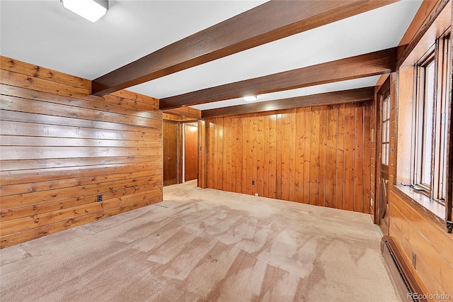 21849 Cabrini Blvd, Golden, CO 80401 - carpeted empty room with baseboard heating, beam ceiling, and wooden walls