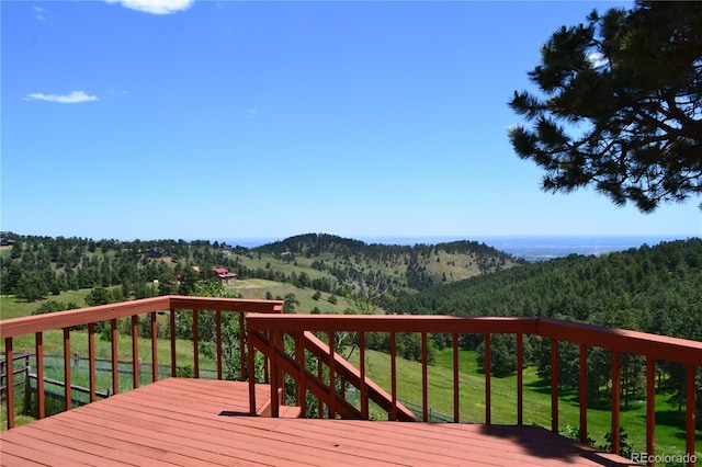 21849 Cabrini Blvd, Golden, CO 80401 - deck featuring a wooded view and a mountain view
