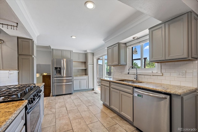 9350 Raleigh Ct, Westminster, CO 80031 - kitchen featuring appliances with stainless steel finishes, gray cabinetry, ornamental molding, healthy amount of natural light, and recessed lighting