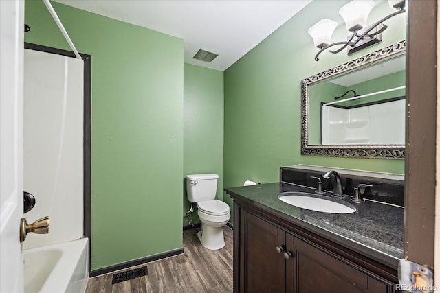 9350 Raleigh Ct, Westminster, CO 80031 - full bathroom featuring wood finished floors, vanity, and shower / tub combination