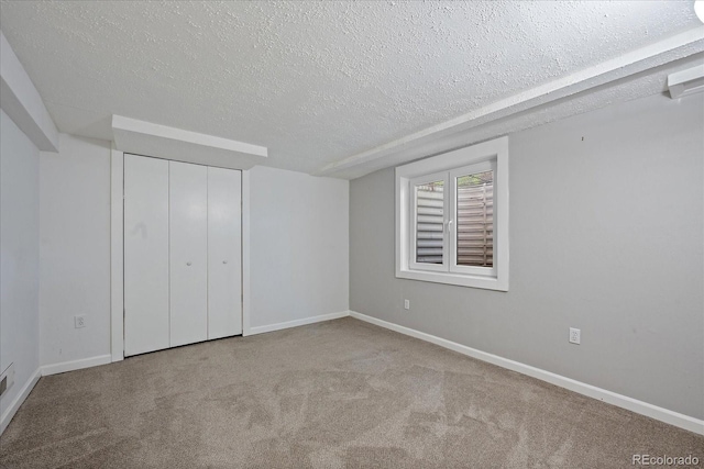 9350 Raleigh Ct, Westminster, CO 80031 - unfurnished bedroom with a textured ceiling, carpet floors, and a closet
