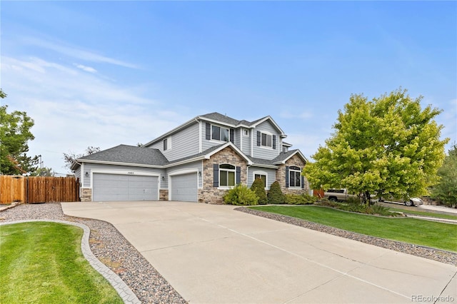 view of front of house with a garage and a front lawn