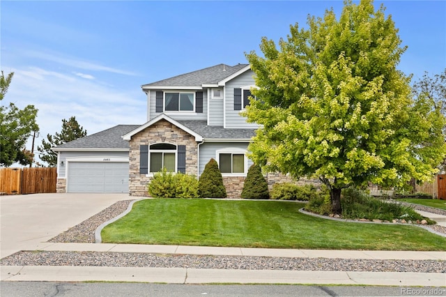 view of front of house with a garage and a front lawn