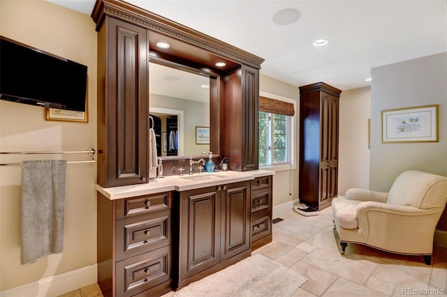 bathroom with vanity and tile patterned flooring