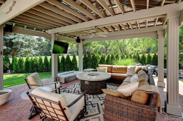 view of patio featuring an outdoor living space with a fire pit and ceiling fan