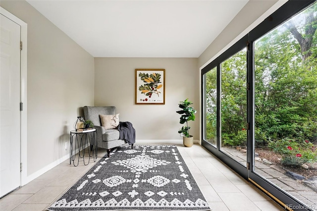 5436 E Atlantic Pl, Denver, CO 80222 - sitting room with light tile patterned floors and baseboards