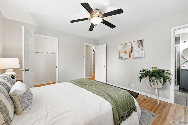 5436 E Atlantic Pl, Denver, CO 80222 - bedroom featuring light wood finished floors, baseboards, ceiling fan, and connected bathroom