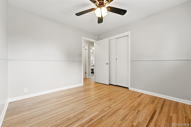 5436 E Atlantic Pl, Denver, CO 80222 - unfurnished bedroom featuring wood finished floors, baseboards, a closet, and a ceiling fan