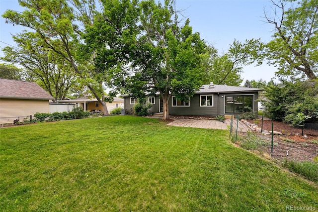 5436 E Atlantic Pl, Denver, CO 80222 - view of grassy yard with a patio area