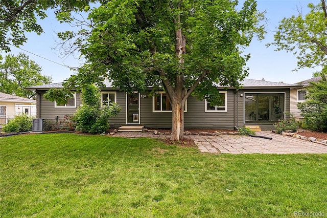 5436 E Atlantic Pl, Denver, CO 80222 - back of property featuring central air condition unit, a lawn, and a patio area