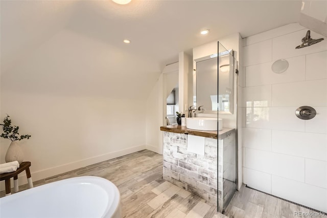 3521 Osage St, Denver, CO 80211 - full bathroom with a bathtub, vanity, wood finished floors, a tile shower, and vaulted ceiling