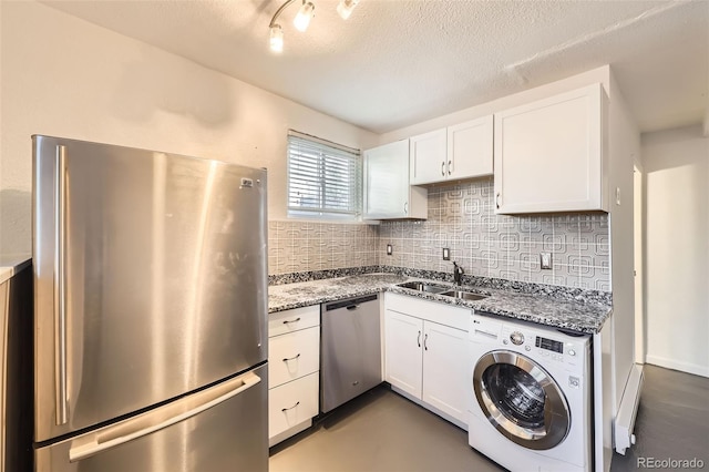 3521 Osage St, Denver, CO 80211 - kitchen with washer / clothes dryer, appliances with stainless steel finishes, a sink, backsplash, and a textured ceiling