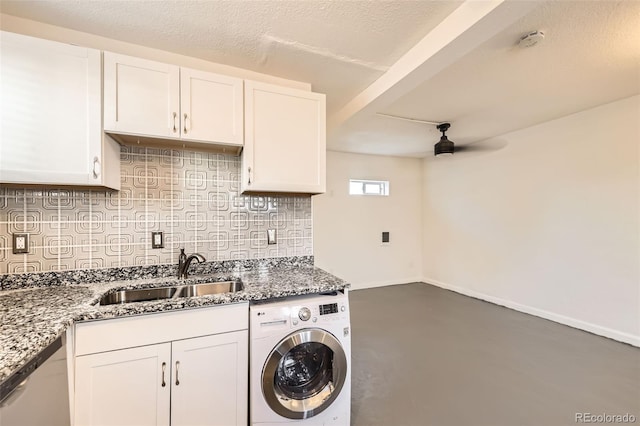 3521 Osage St, Denver, CO 80211 - kitchen with washer / dryer, dishwasher, a sink, white cabinetry, and decorative backsplash