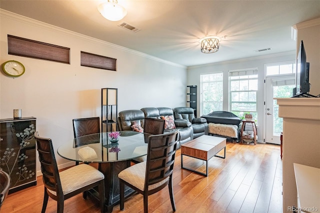 13456 Via Varra Unit 225, Broomfield, CO 80020 - dining room featuring ornamental molding and wood finished floors