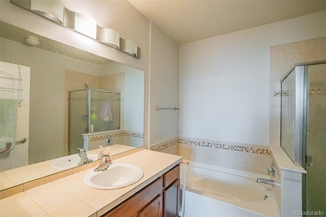 13456 Via Varra Unit 225, Broomfield, CO 80020 - full bath featuring a stall shower, a bath, and vanity