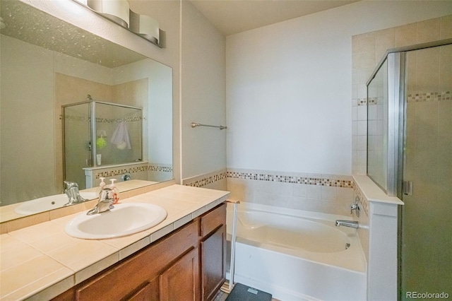 13456 Via Varra Unit 225, Broomfield, CO 80020 - full bath featuring a stall shower, a garden tub, and vanity