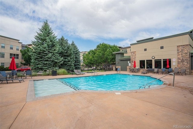 13456 Via Varra Unit 225, Broomfield, CO 80020 - community pool with a patio