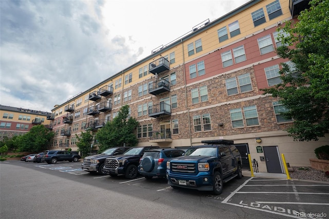 13456 Via Varra Unit 225, Broomfield, CO 80020 - view of apartment building / complex with uncovered parking