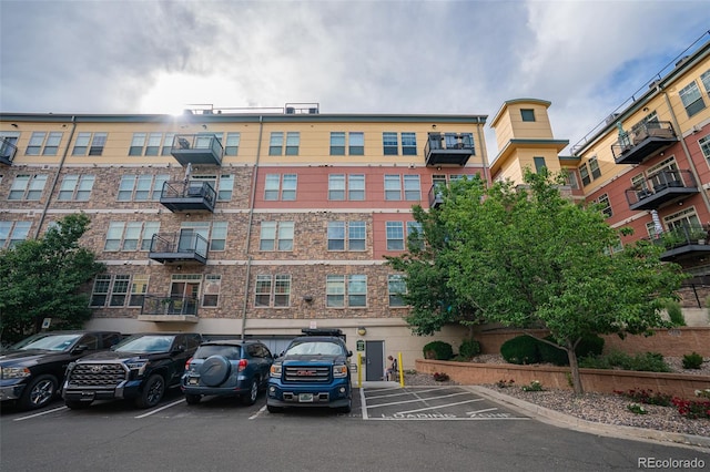 13456 Via Varra Unit 225, Broomfield, CO 80020 - view of apartment building / complex featuring uncovered parking