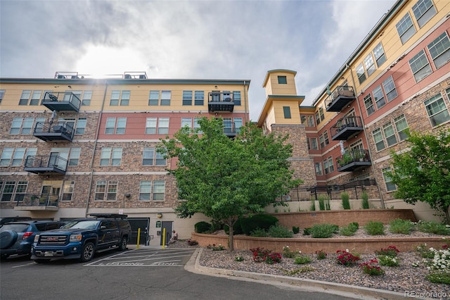 13456 Via Varra Unit 225, Broomfield, CO 80020 - view of apartment building / complex with uncovered parking
