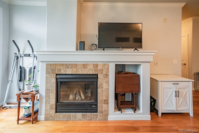 13456 Via Varra Unit 225, Broomfield, CO 80020 - detailed view of wood finished floors, ornamental molding, and a fireplace