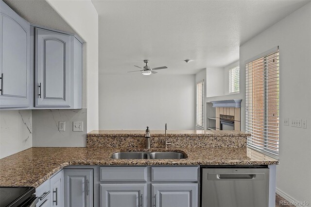 750 Capeglen Rd, Colorado Springs, CO 80906 - kitchen featuring stainless steel dishwasher, a sink, a ceiling fan, decorative backsplash, and stone countertops