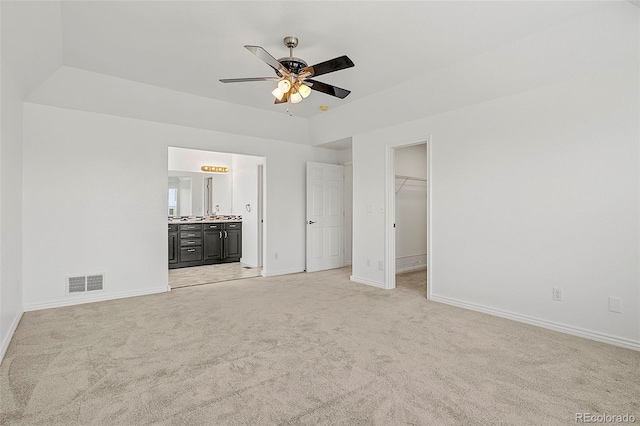 750 Capeglen Rd, Colorado Springs, CO 80906 - unfurnished bedroom featuring light colored carpet, baseboards, a walk in closet, and ensuite bath