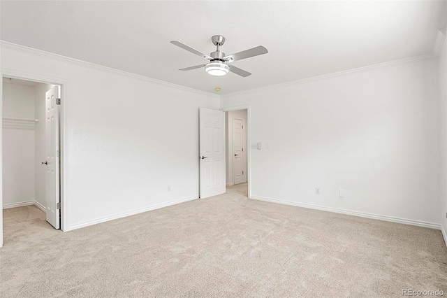750 Capeglen Rd, Colorado Springs, CO 80906 - unfurnished bedroom with light carpet, a spacious closet, crown molding, and baseboards