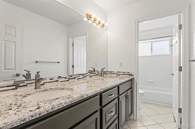 750 Capeglen Rd, Colorado Springs, CO 80906 - bathroom featuring toilet, double vanity, and tile patterned floors