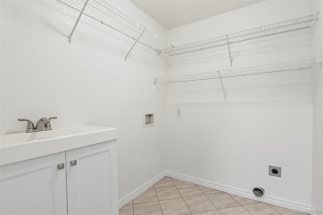 750 Capeglen Rd, Colorado Springs, CO 80906 - laundry room with electric dryer hookup, washer hookup, baseboards, and cabinet space