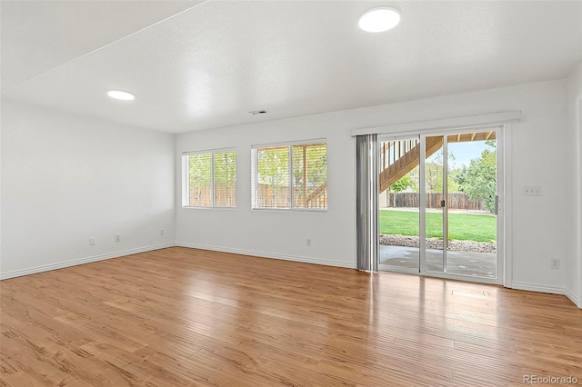750 Capeglen Rd, Colorado Springs, CO 80906 - spare room with healthy amount of natural light, baseboards, and wood finished floors