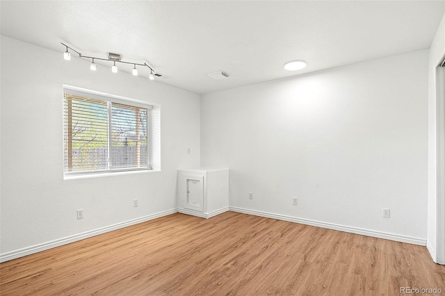 750 Capeglen Rd, Colorado Springs, CO 80906 - spare room featuring light wood-style flooring and baseboards