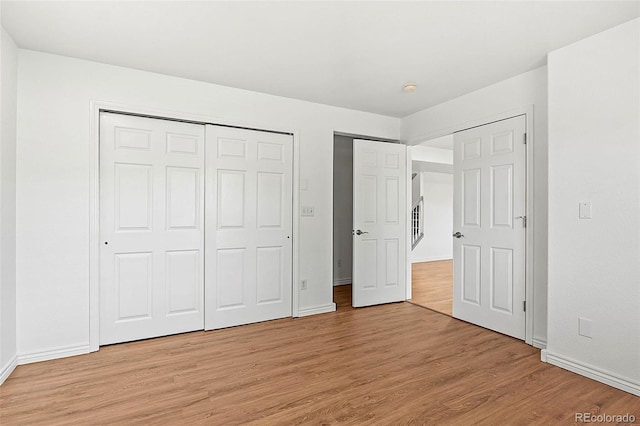 750 Capeglen Rd, Colorado Springs, CO 80906 - unfurnished bedroom with light wood-type flooring, baseboards, and a closet