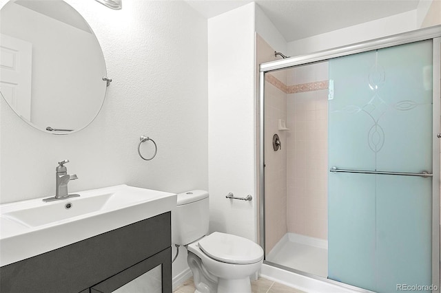 750 Capeglen Rd, Colorado Springs, CO 80906 - bathroom featuring toilet, a stall shower, vanity, and tile patterned flooring