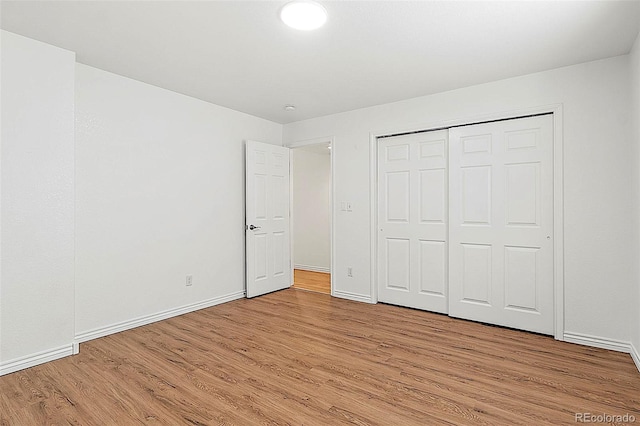 750 Capeglen Rd, Colorado Springs, CO 80906 - unfurnished bedroom featuring light wood-style floors, baseboards, and a closet