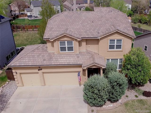 750 Capeglen Rd, Colorado Springs, CO 80906 - view of front of house featuring stucco siding, concrete driveway, a residential view, and fence