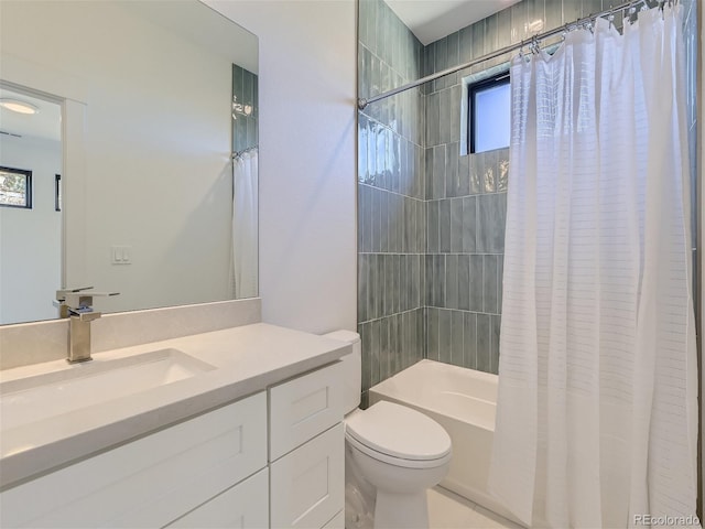 full bathroom with tile floors, toilet, shower / bath combination with curtain, and vanity