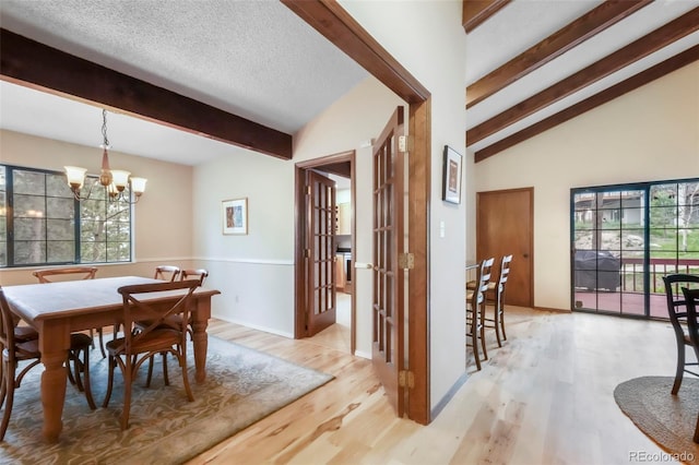 510 Silhouette Way, Monument, CO 80132 - dining area featuring a chandelier, light wood-type flooring, and plenty of natural light