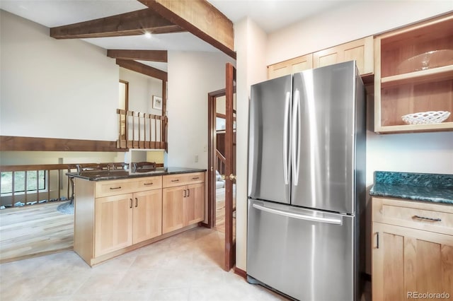 510 Silhouette Way, Monument, CO 80132 - kitchen with freestanding refrigerator, light brown cabinetry, beam ceiling, and dark stone countertops