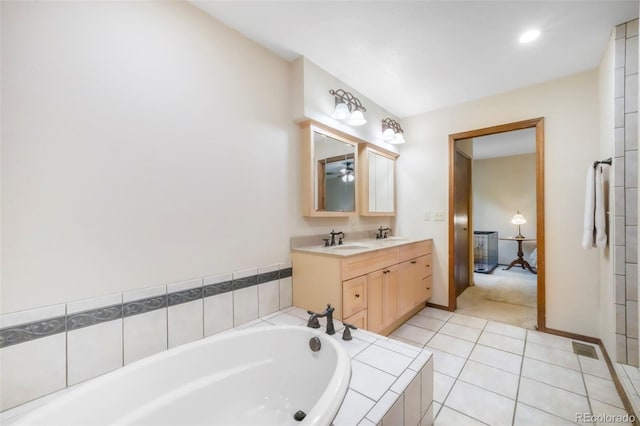 510 Silhouette Way, Monument, CO 80132 - ensuite bathroom featuring a bath, double vanity, tile patterned floors, and recessed lighting