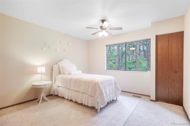 510 Silhouette Way, Monument, CO 80132 - bedroom with light carpet and a ceiling fan
