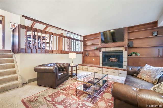 510 Silhouette Way, Monument, CO 80132 - living room featuring stairs, a fireplace, and carpet flooring